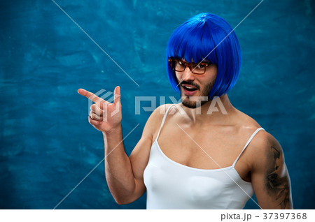 Transsexual person wearing blue wig and glasses 37397368