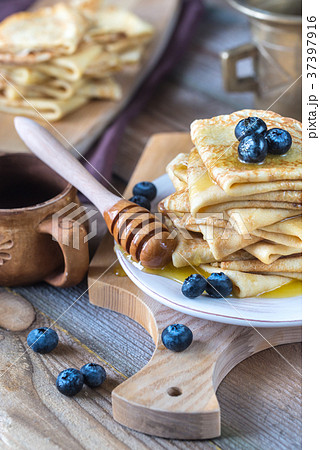Crepes with fresh blueberries and honey 37397916