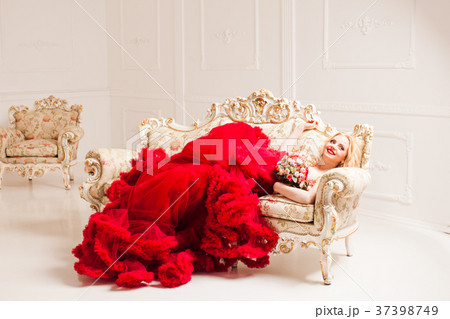 Woman in red cloudy dress 37398749