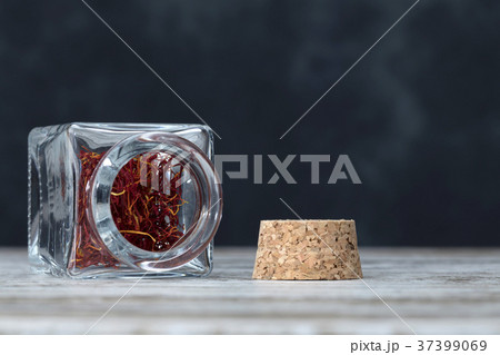 saffron threads in an open jar saffron threads in an open jar 37399069