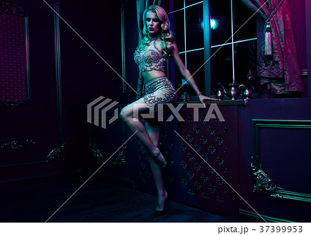 Beautiful sexy blonde woman on violet background Beautiful sexy blonde woman on violet background 37399953