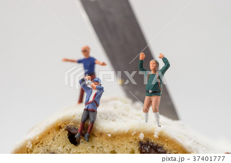 Miniature toy climber with cake 37401777