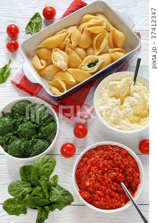 pasta shells with ingredients for filling pasta shells with ingredients for filling 37412347