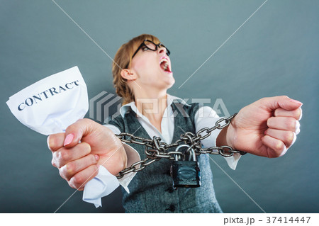Furious woman with chained hands and contract 37414447