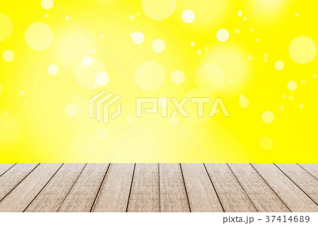 Wood table with yellow color background. 37414689