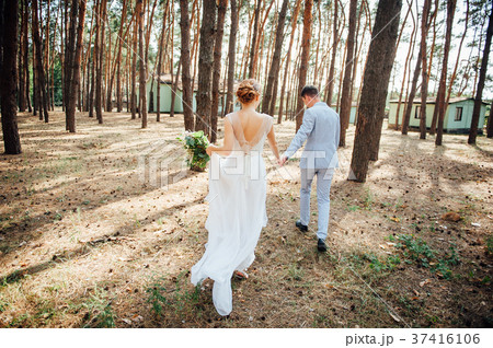 lovers is running with hold hands on city park lovers is running with hold hands on city park 37416106