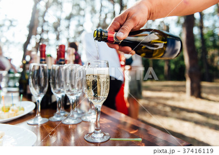 Wedding glasses filled with champagne at banquet 37416119