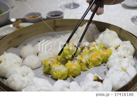 Dim Sum dumplings with steamed buns in container 37416186