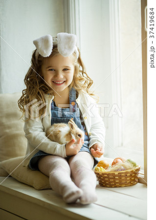 Cute little child girl is wearing bunny ears on Cute little child girl is wearing bunny ears on 37419684