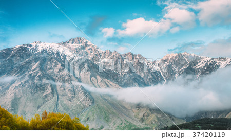 Clouds Over Rocks. Mountain Peaks Covered With Clouds Over Rocks. Mountain Peaks Covered With 37420119