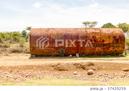 Old rusty tanker on a dirt road Old rusty tanker on a dirt road 37420259