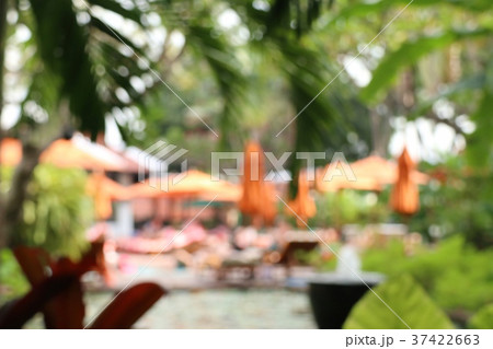 blurred swimming pool with umbrellas blurred swimming pool with umbrellas 37422663