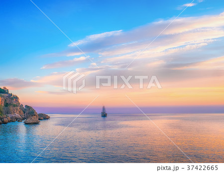 Tall ship sailing on sea in the evening sunlight 37422665