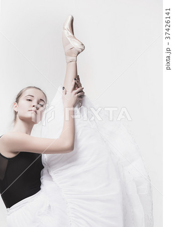 Young classical dancer isolated on white Young classical dancer isolated on white 37426141