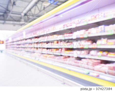 Defocused blur of supermarket shelves 37427384