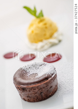 delicious chocolate hot cake with fruit sauce 37427524