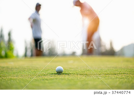 Golf ball approach to the hold on the green.  37440774