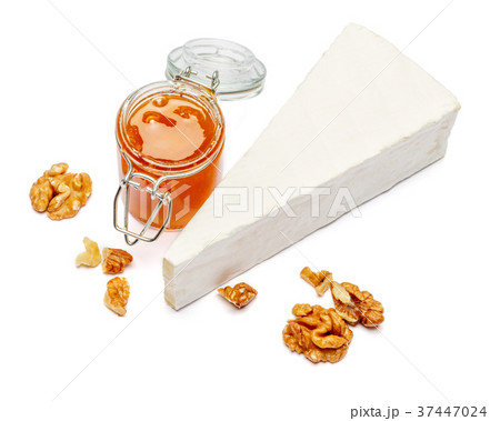 Piece of brie or camambert cheese on a white Piece of brie or camambert cheese on a white 37447024