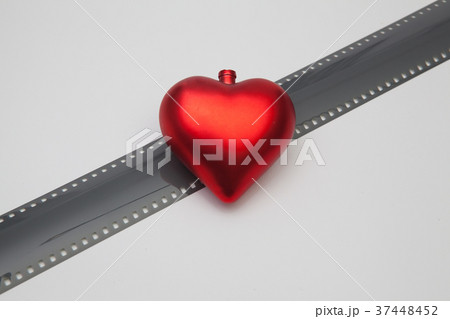 The red heart and the unrolled exposed 35mm film 37448452