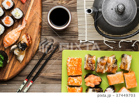 Set of sushi rolls, chopsticks, soy sauce and Set of sushi rolls, chopsticks, soy sauce and 37449703