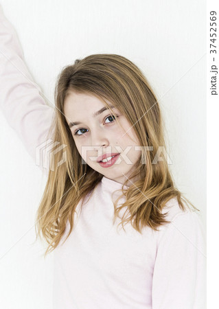 Sinister girl with blond hair in striped clothes 37452569