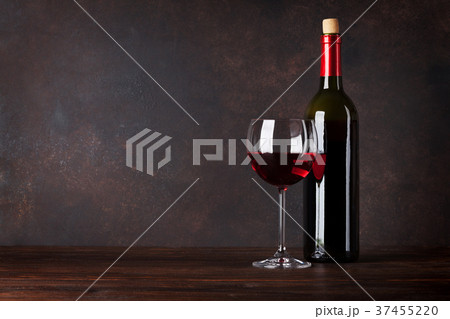 Red wine bottle and glass 37455220