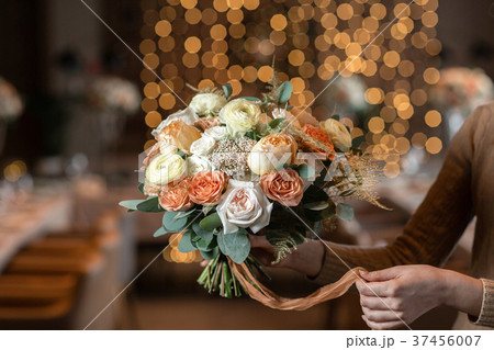 beautiful luxury bouquet of mixed flowers in woman 37456007