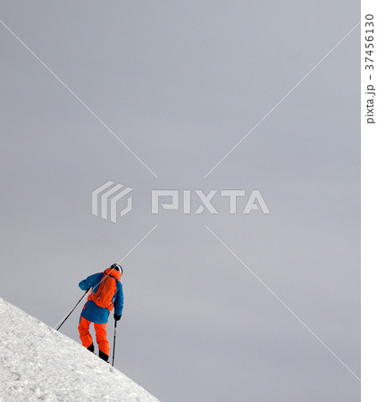 Skier before downhill on snowy freeride slope 37456130