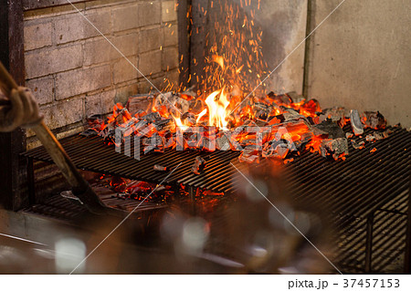 Typical Argentinian barbecue or asado. Burning Typical Argentinian barbecue or asado. Burning 37457153