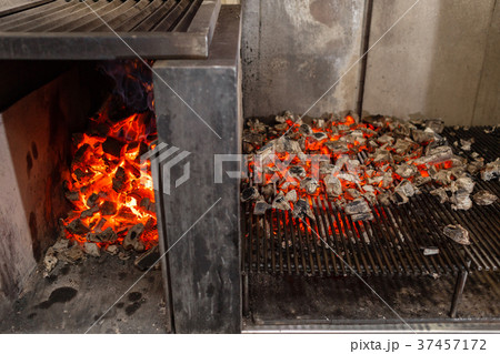Typical Argentinian barbecue or asado. Burning Typical Argentinian barbecue or asado. Burning 37457172