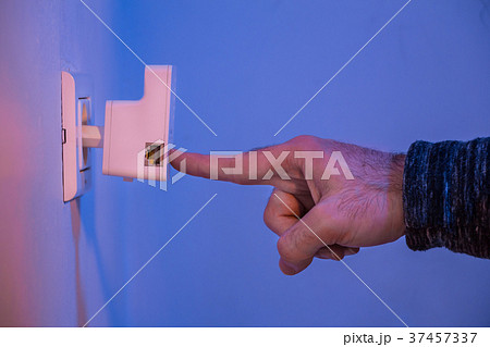 Man press on WPS button on WiFi repeater Man press on WPS button on WiFi repeater 37457337