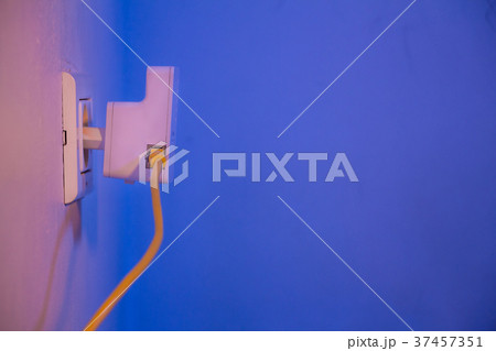 WiFi extender in electrical socket on the wall 37457351