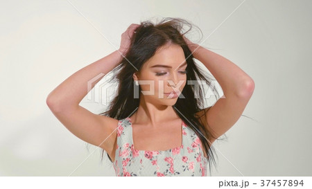 Portrait of beautiful young woman at studio on the 37457894