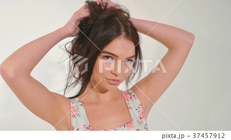 Portrait of beautiful young woman at studio on the 37457912