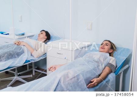 Female patient resting in medical bed at the 37458054