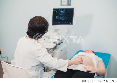 Doctor using ultrasound and screening stomach of Doctor using ultrasound and screening stomach of 37458119