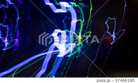 Multicolored light moving at night. Multicolored light moving at night. 37466180