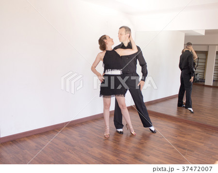 Couple of dancers dancing latin dances Couple of dancers dancing latin dances 37472007