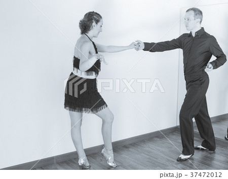 Couple of dancers dancing latin dances Couple of dancers dancing latin dances 37472012