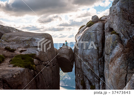 Woman on Kjeragbolten Travel in Norway Woman on Kjeragbolten Travel in Norway 37473643