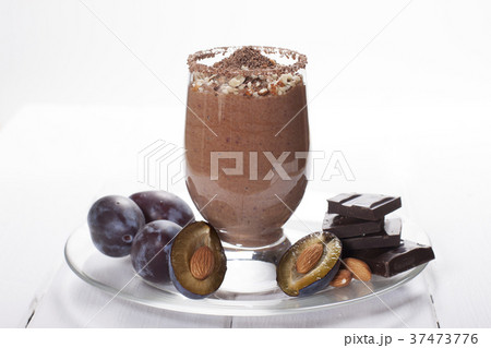 Smoothies of plums, chocolate with nuts and yogurt 37473776