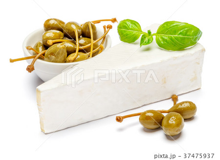 Piece of brie or camambert cheese and capers on a 37475937