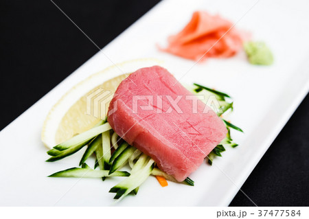 Tuna sashimi served on a plate 37477584