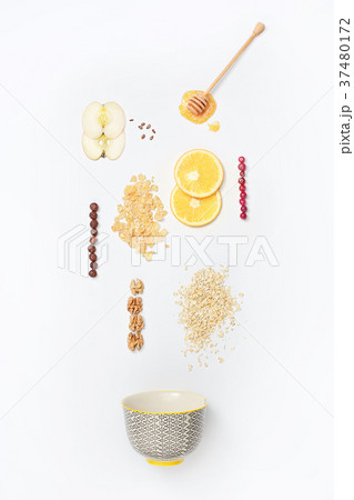 Falling granola with falling blueberries and honey Falling granola with falling blueberries and honey 37480172