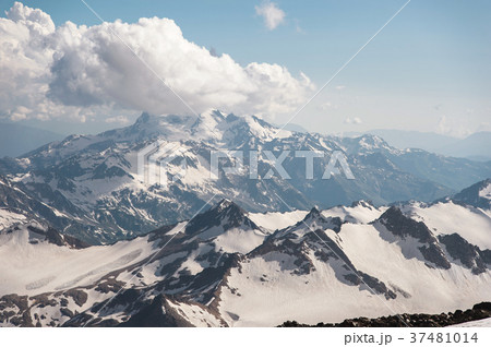 Dark blue sky with clouds on the rocky peaks of Dark blue sky with clouds on the rocky peaks of 37481014