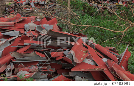 Broken roof tiles are waiting to destroy. 37482995