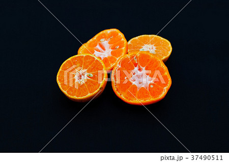 Orange on black background. Orange on black background. 37490511