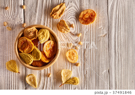 Dried fruits on wooden background Dried fruits on wooden background 37491846
