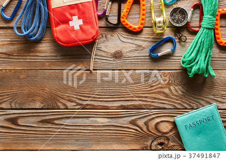 Travel items for hiking over wooden background 37491847