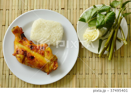 grilled chicken leg eat with sticky rice grilled chicken leg eat with sticky rice 37495401